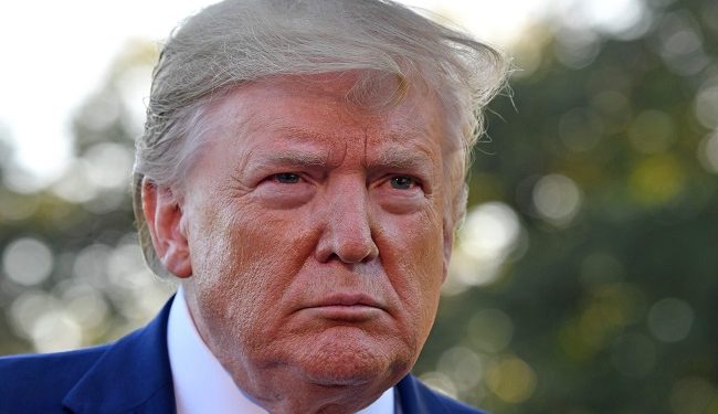 (FILES) In this file photo taken on October 11, 2019 US President Donald Trump speaks to the press after announcing and initial deal with China on the South Lawn of the White House in Washington, DC. - President Donald Trump suggested on October 14, 2019 that Kurdish fighters may be releasing imprisoned Islamic State group jihadists to bait the United States into remaining involved in northeastern Syria. The Pentagon said Sunday Trump had ordered the withdrawal of up to 1,000 troops from northern Syria -- almost the entire ground force in the war-torn country -- amid an intensifying Turkish assault on Kurdish forces. (Photo by Nicholas Kamm / AFP)