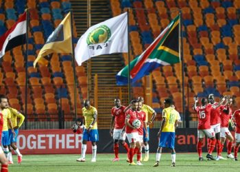 Ahly's players celebrate after winning the first leg of the CAF Champions League Quarter-final football match between Egypt's Al-Ahly and South Africa's Mamelodi Sundowns at al-Ahly Stadium in the capital Cairo on February 29, 2020. (Photo by Khaled DESOUKI / AFP)