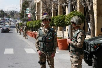 Jordanian army members stand guard outside a hotel that was transformed into a quarantine station amid concerns over the coronavirus (COVID-19) in Amman, Jordan, March 17, 2020. REUTERS/Muhammad Hamed