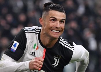 Juventus' Portuguese forward Cristiano Ronaldo celebrates after scoring his third goal during the Italian Serie A football match Juventus vs Cagliari on January 6, 2020 at the Juventus Allianz stadium in Turin. (Photo by Marco Bertorello / AFP)