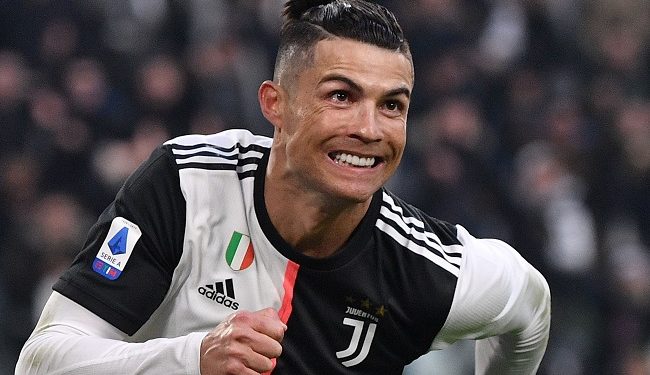 Juventus' Portuguese forward Cristiano Ronaldo celebrates after scoring his third goal during the Italian Serie A football match Juventus vs Cagliari on January 6, 2020 at the Juventus Allianz stadium in Turin. (Photo by Marco Bertorello / AFP)