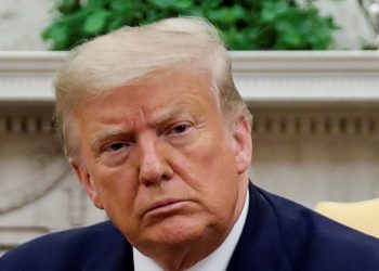 U.S. President Donald Trump listens during a meeting with family members of slain Fort Hood soldier Vanessa Guillen, who was was found dead after disappearing from the army base in Texas, in the Oval Office at the White House in Washington, U.S., July 30, 2020. REUTERS/Carlos Barria