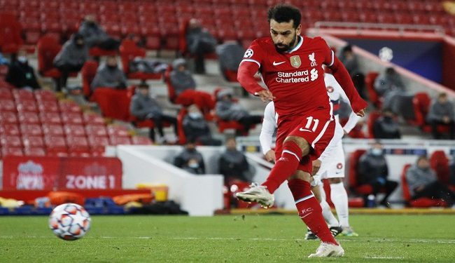 Soccer Football - Champions League - Group D - Liverpool v FC Midtjylland - Anfield, Liverpool, Britain - October 27, 2020 Liverpool's Mohamed Salah scores their second goal from the penalty spot Pool via REUTERS/Phil Noble