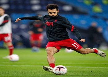 Liverpool's Egyptian midfielder Mohamed Salah warms up ahead of the English Premier League football match between Manchester City and Liverpool at the Etihad Stadium in Manchester, north west England, on November 8, 2020. (Photo by Clive Brunskill / POOL / AFP) / RESTRICTED TO EDITORIAL USE. No use with unauthorized audio, video, data, fixture lists, club/league logos or 'live' services. Online in-match use limited to 120 images. An additional 40 images may be used in extra time. No video emulation. Social media in-match use limited to 120 images. An additional 40 images may be used in extra time. No use in betting publications, games or single club/league/player publications. /