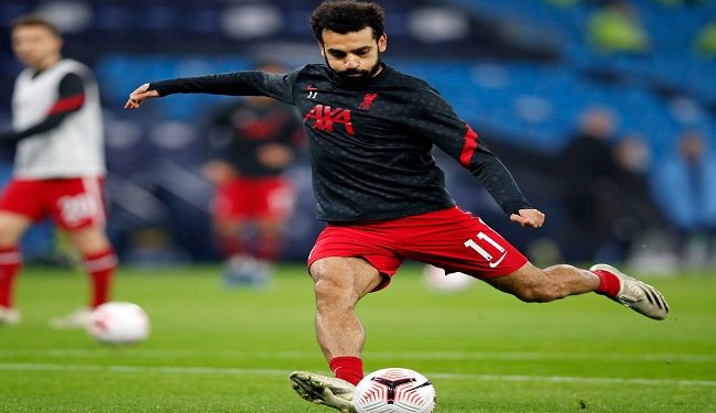 Liverpool's Egyptian midfielder Mohamed Salah warms up ahead of the English Premier League football match between Manchester City and Liverpool at the Etihad Stadium in Manchester, north west England, on November 8, 2020. (Photo by Clive Brunskill / POOL / AFP) / RESTRICTED TO EDITORIAL USE. No use with unauthorized audio, video, data, fixture lists, club/league logos or 'live' services. Online in-match use limited to 120 images. An additional 40 images may be used in extra time. No video emulation. Social media in-match use limited to 120 images. An additional 40 images may be used in extra time. No use in betting publications, games or single club/league/player publications. /