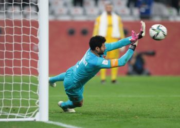 Soccer Football - Club World Cup - Third Place Play Off - Al Ahly v Palmeiras - Education City Stadium, Al Rayyan, Qatar - February 11, 2021 Al Ahly's Mohamed El-Shenawy saves the penalty from Palmeiras' Felipe Melo REUTERS/Mohammed Dabbous